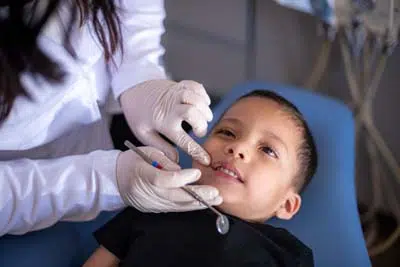 young patient receiving dental care at Sycamore Smiles in Fort Worth, TX