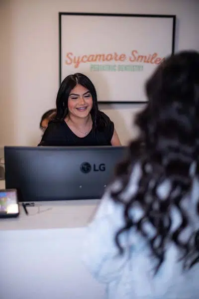 patient scheduling a dental appointment for their child at Sycamore Smiles in Fort Worth, TX